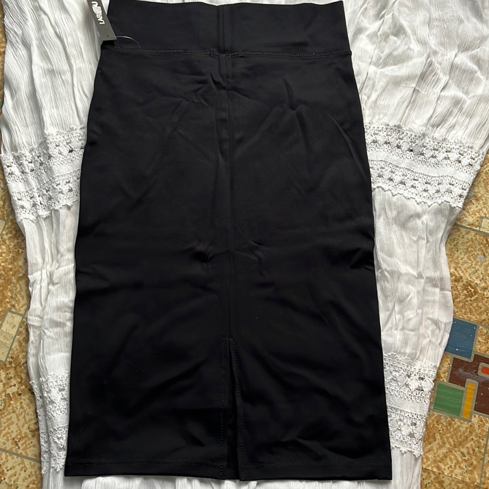 NWT spandex mid length skirt with slit in back.